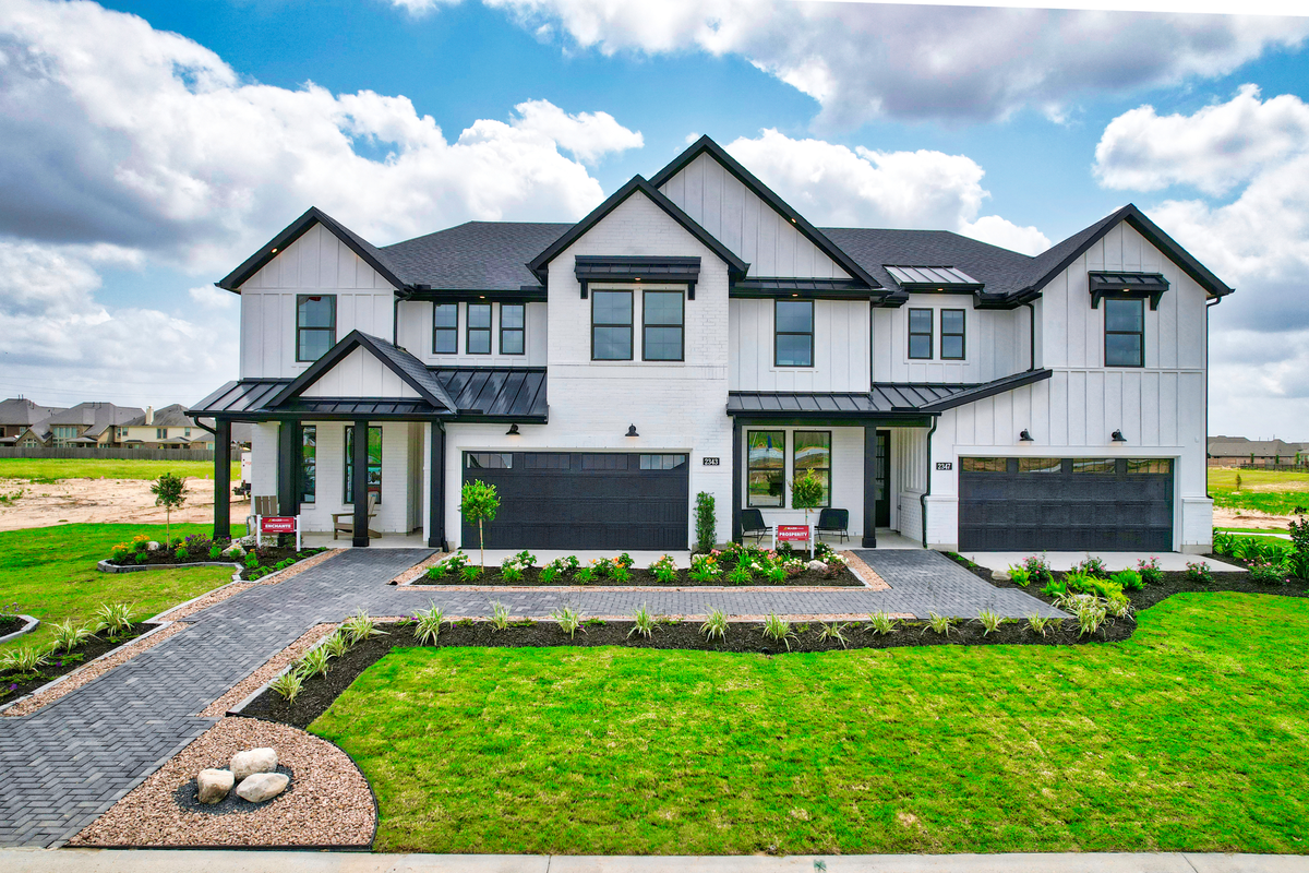model exterior with lush landscaping 