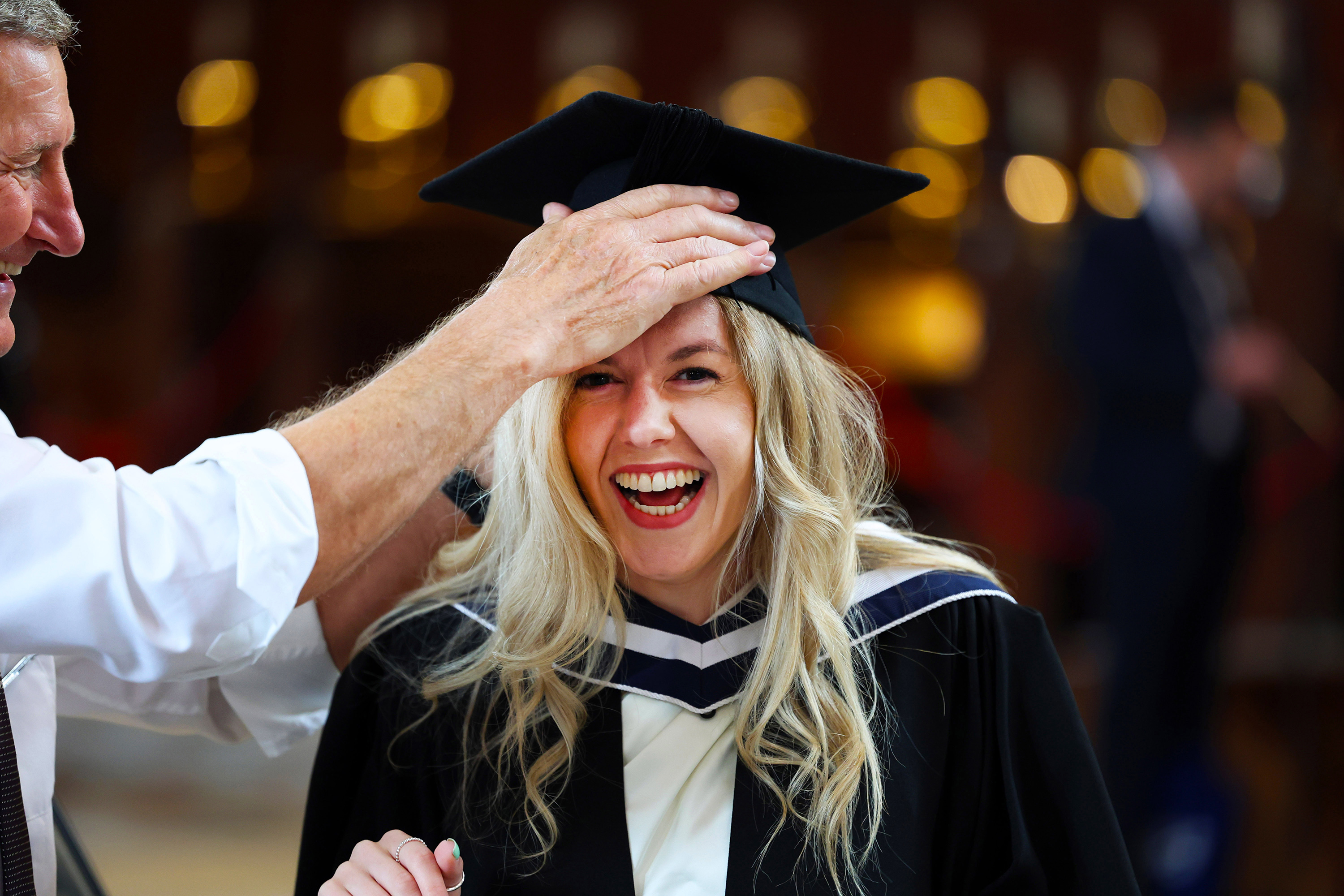 Excited graduate laughing