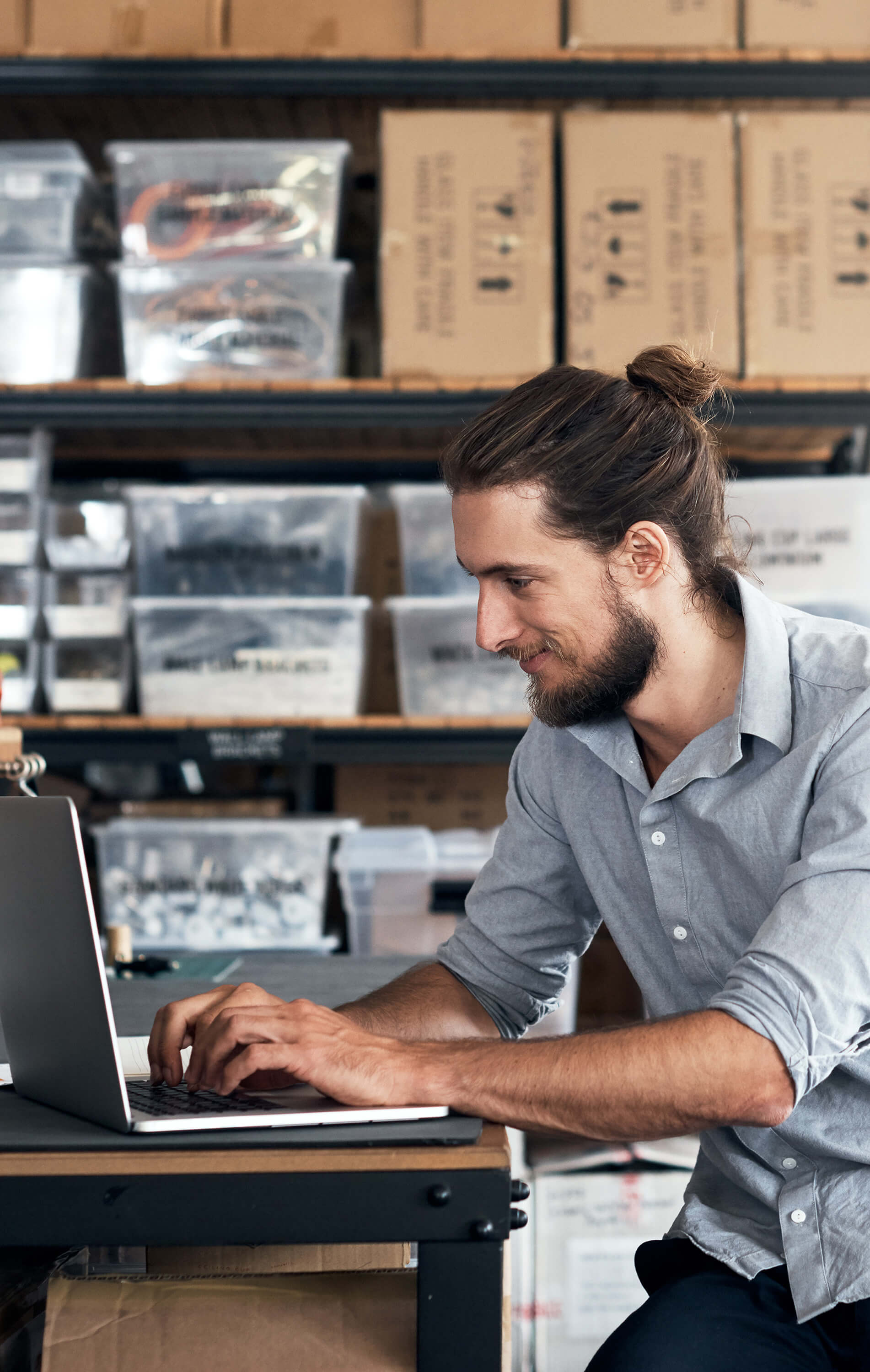 Expanded-Self-Service-915253952-1902x3000.jpg Image of a man typing on a laptop computer.