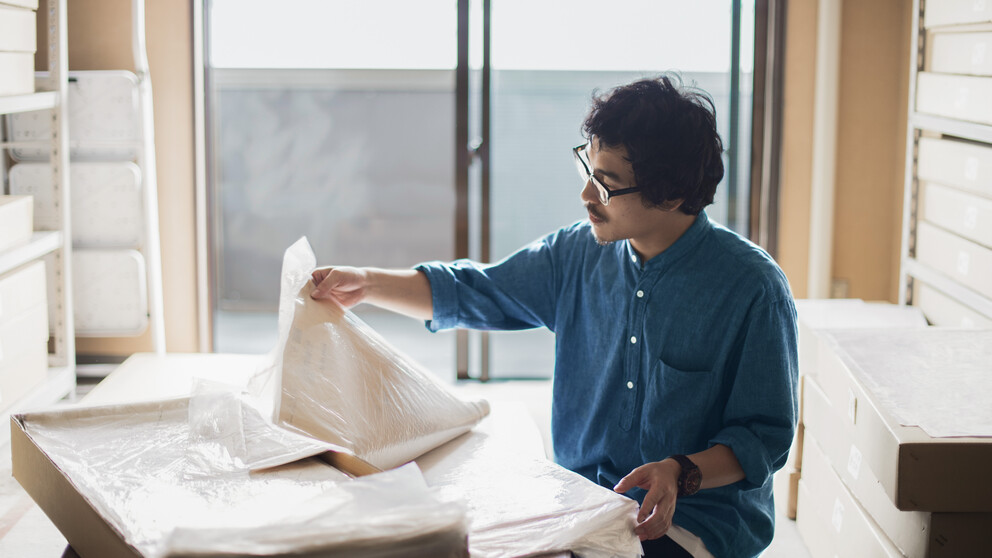 Architect wearing progressive lenses at a drafting table