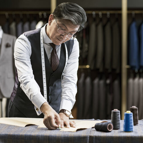 Tailor with glasses at work
