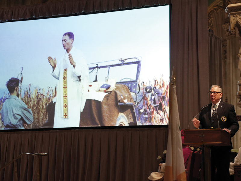 Supreme Master Michael McCusker shares a lesson on military chaplains during the degree ceremony.