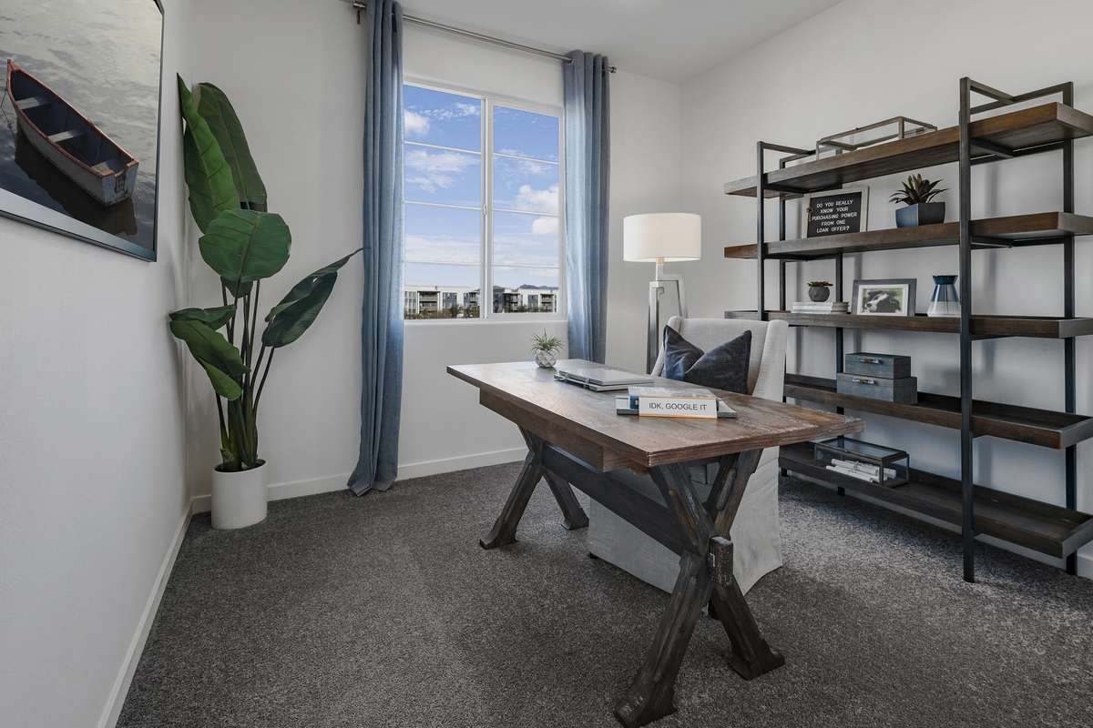 bedroom with desk, chair, and bookshelves