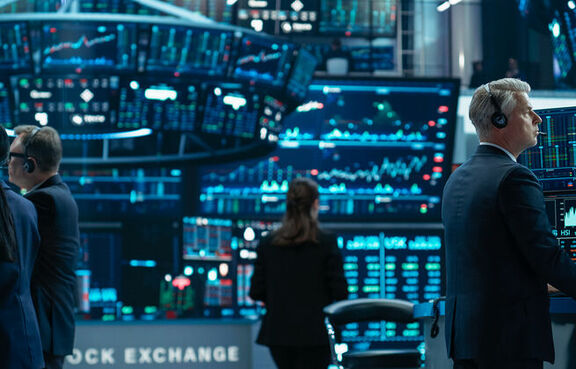 Group of stock exchange traders using sophisticated software