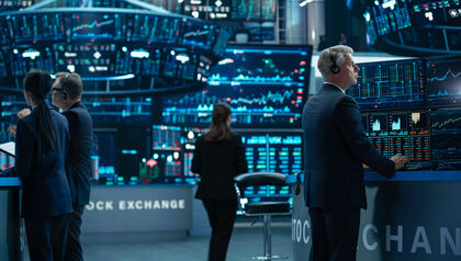 Group of stock exchange traders using sophisticated software