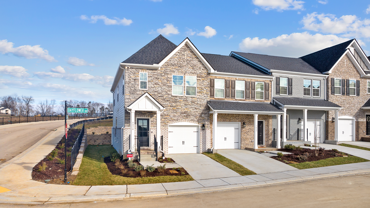 exterior of 3 brick townhome units