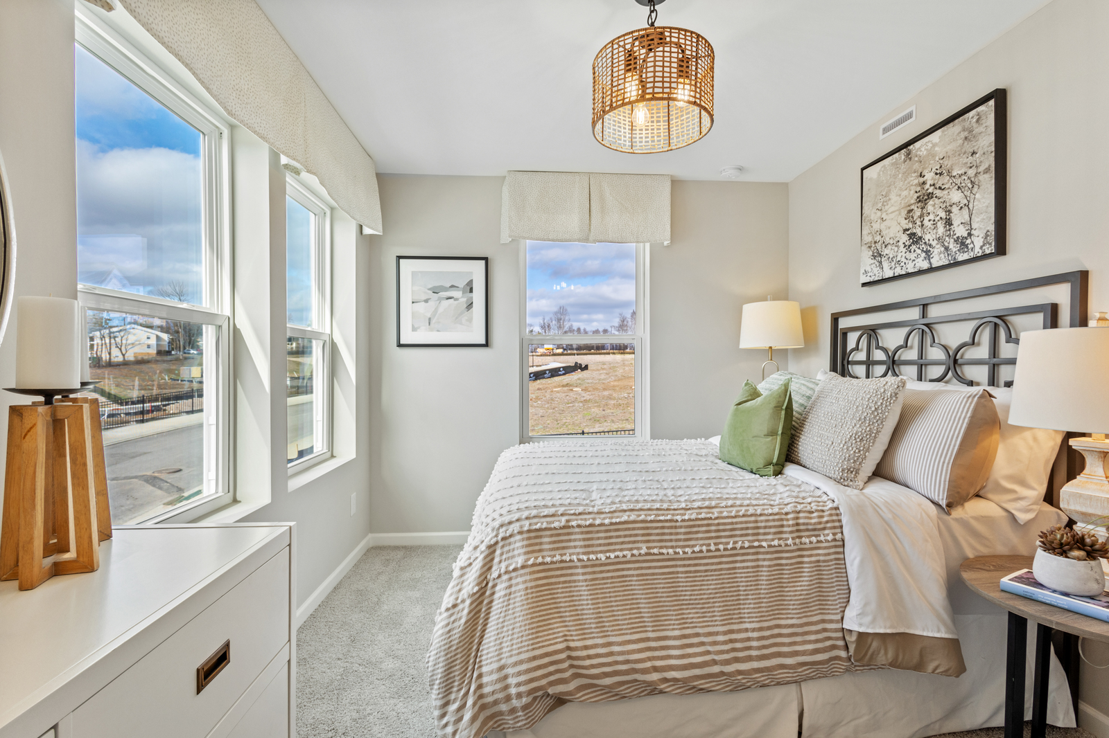 bedroom with large windows and carpet