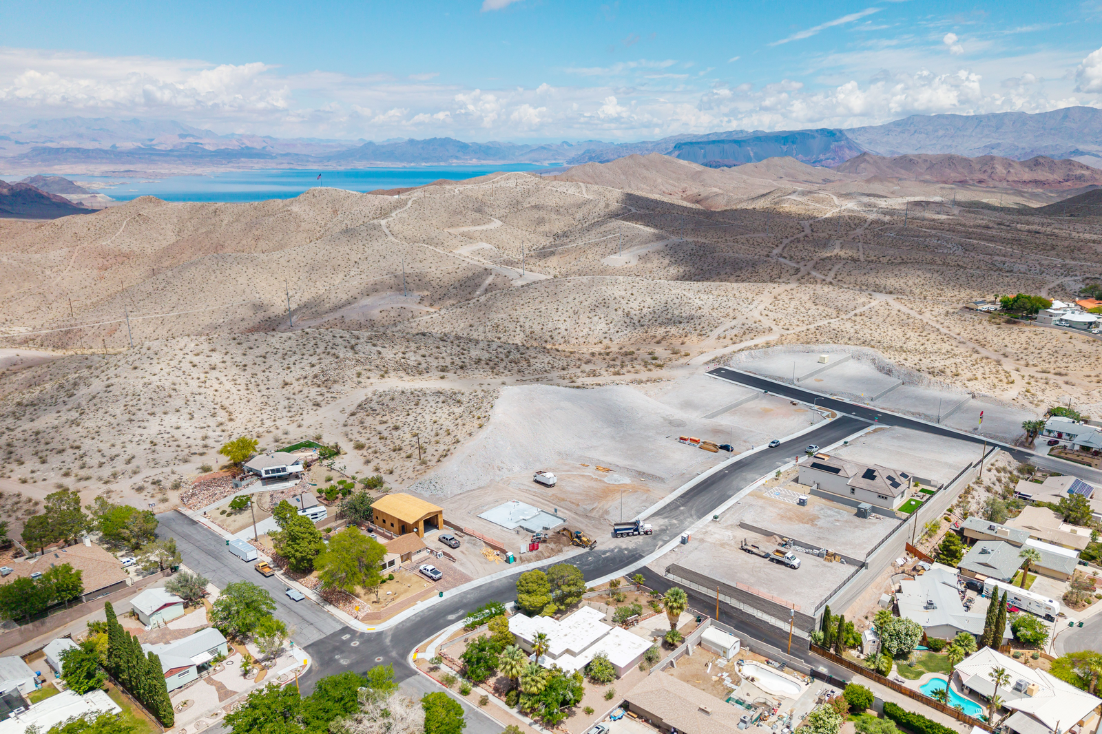 community with surrounding mountains and lake view