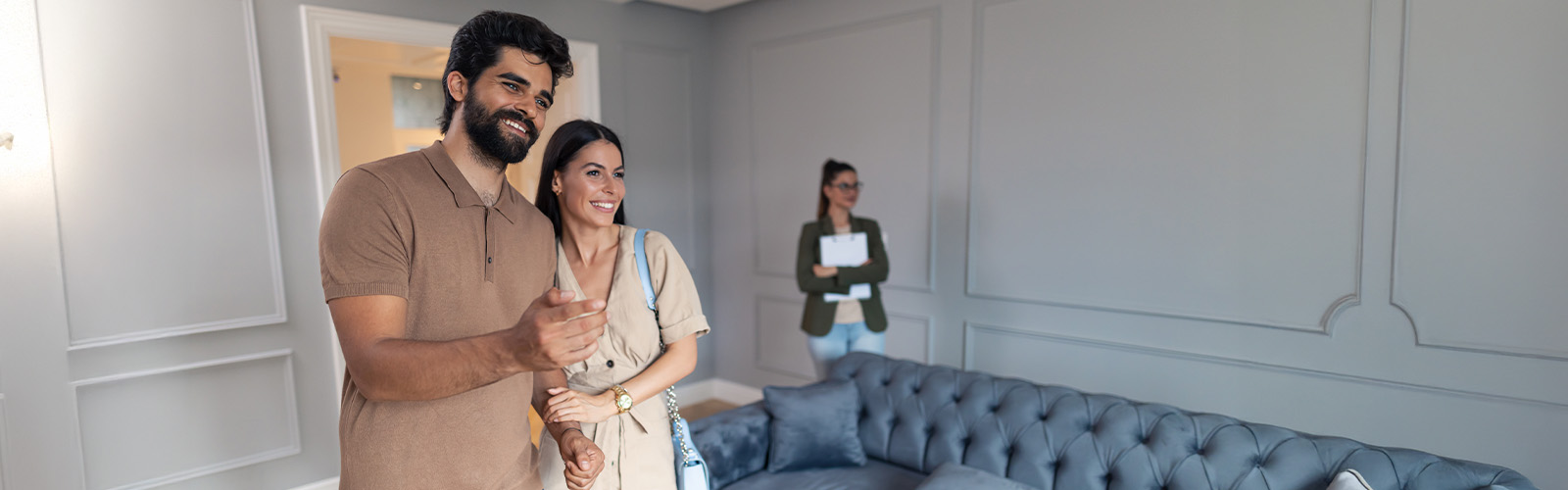 A happy couple looking at a home