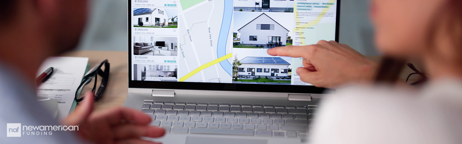 A couple looking at home listings online.