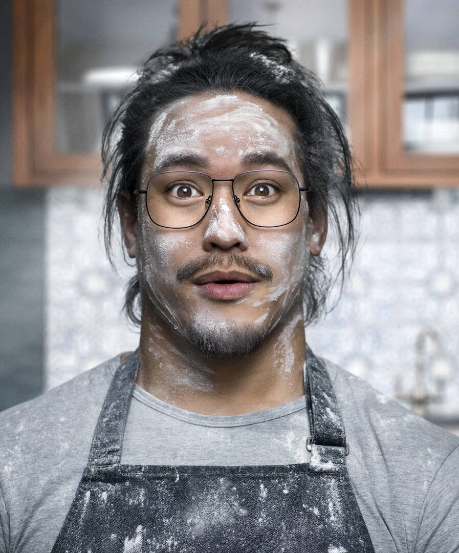 Surprised looking baker with flour in his face is wearing clean glasses with HOYA Hi-Vision Meiryo lenses