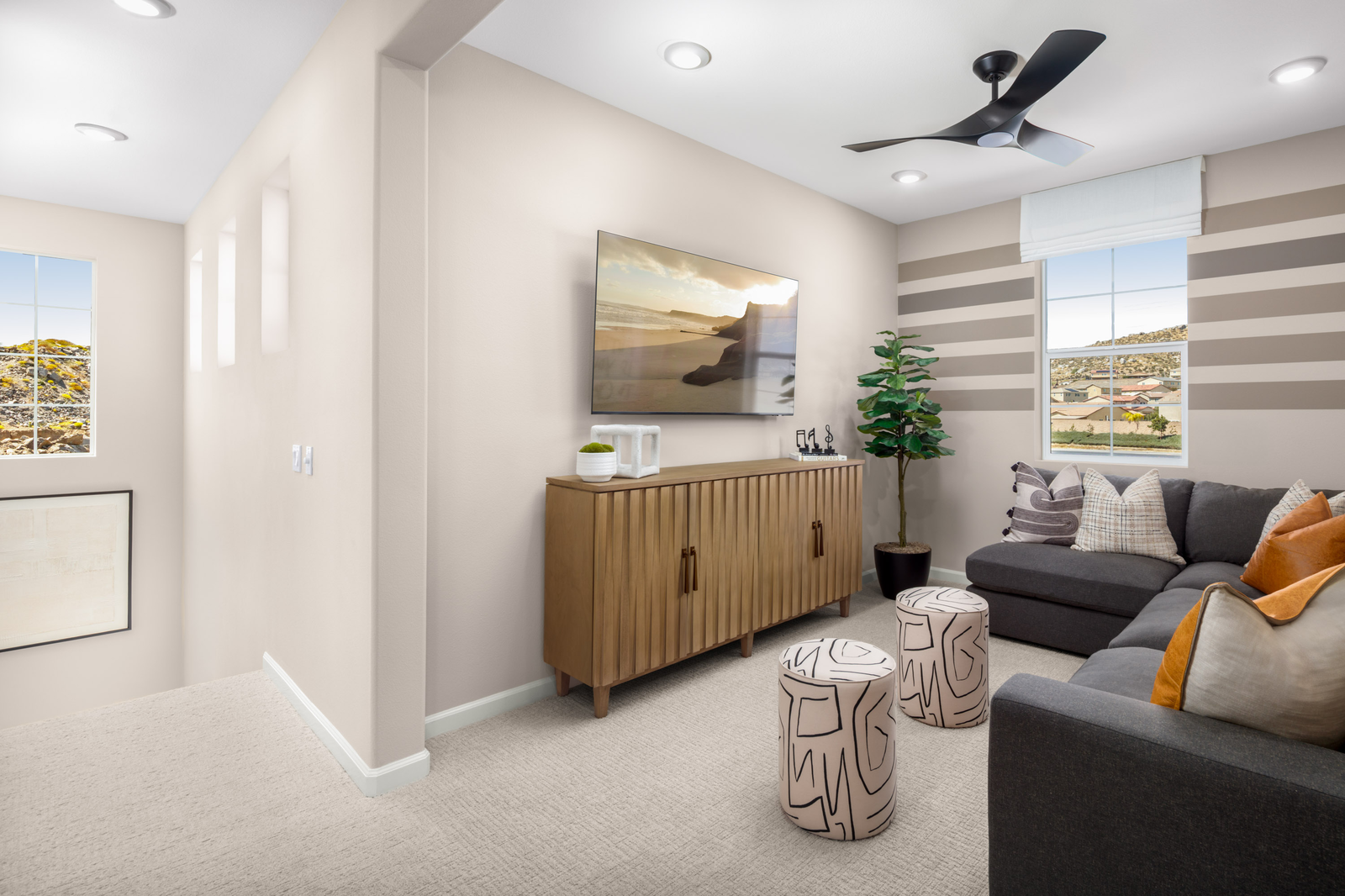 loft with neutral floors and large window