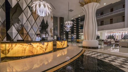 Ornate reception desk in the lobby of a hotel