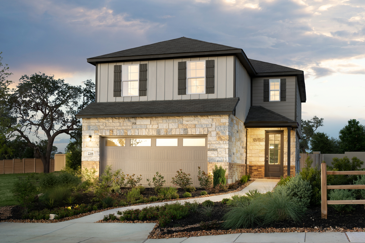 2-story exterior with stone & wood clad