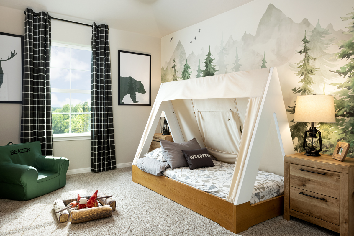 secondary bedroom with carpet and ceiling fan