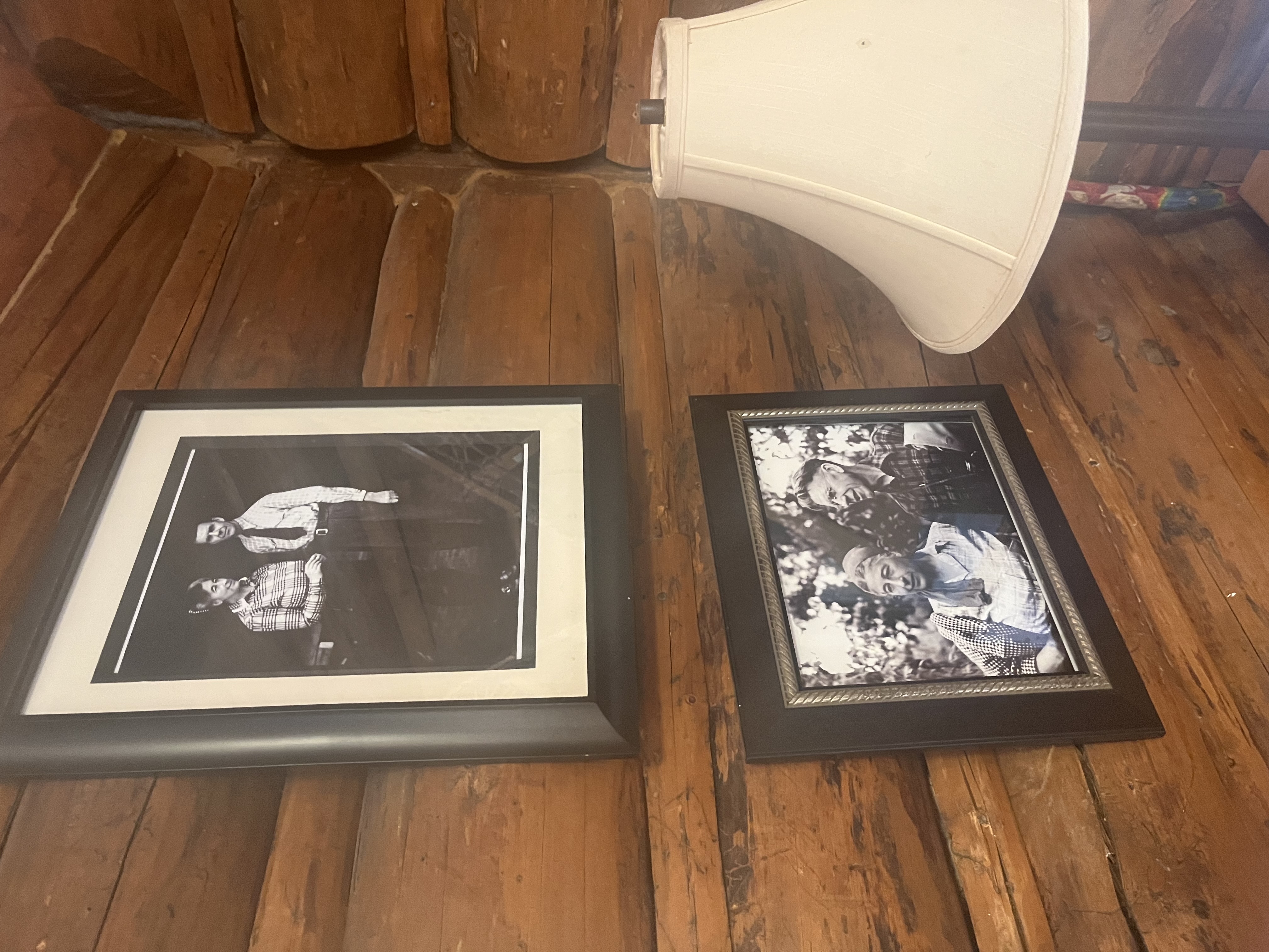 Black and white photos of the Muries line the log cabin walls