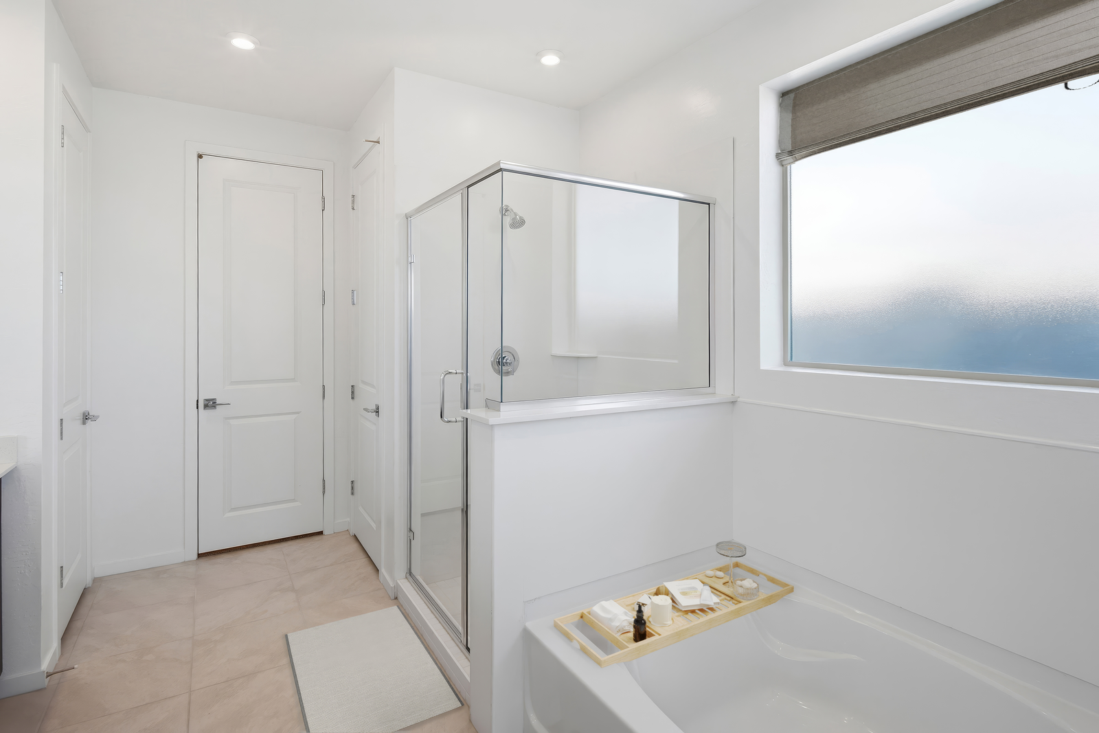 spacious bathroom with a walk-in shower and a soaking tub