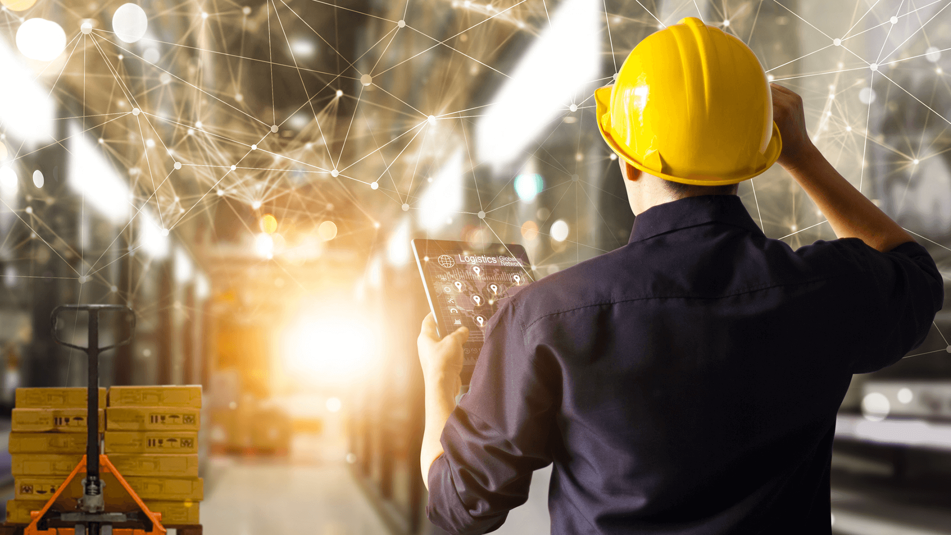 Inventory-Visibility-Availability-In-Page-3.png Image of a man wearing a hardhat standing in a warehouse.
