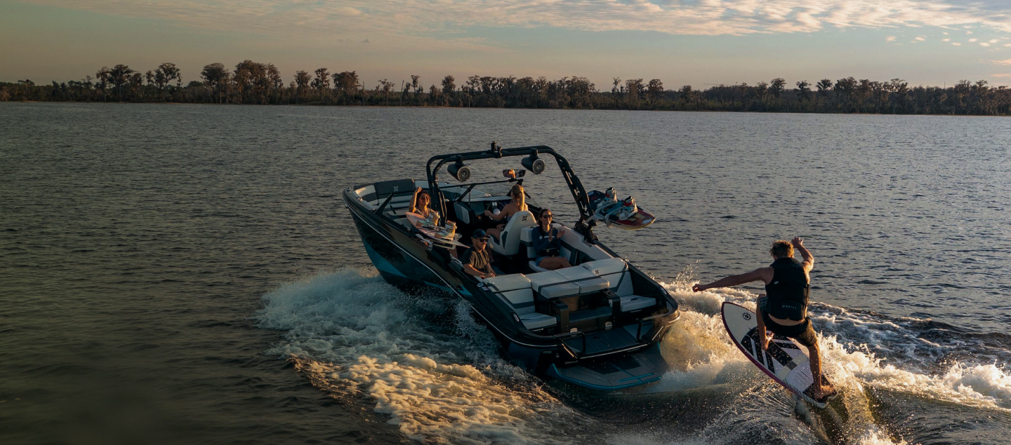 A speedboat with a water-skier