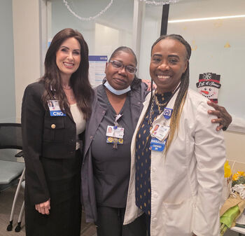 Jean Small celebrates receiving a 2026 midyear Sunflower Award with Moffitt nursing leadership.