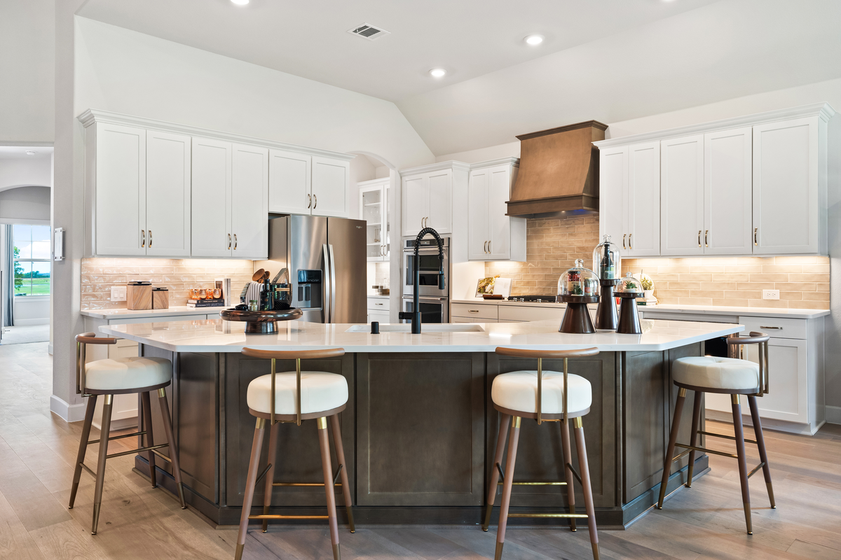 open kitchen with white cabinets and large island