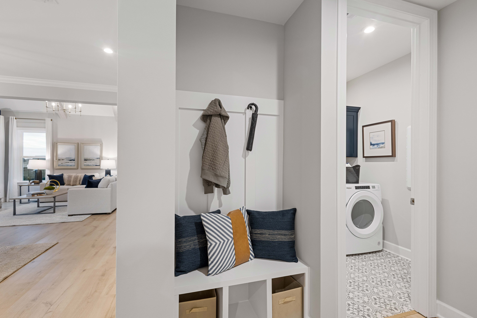 valet bench with hooks for storage by laundryroom