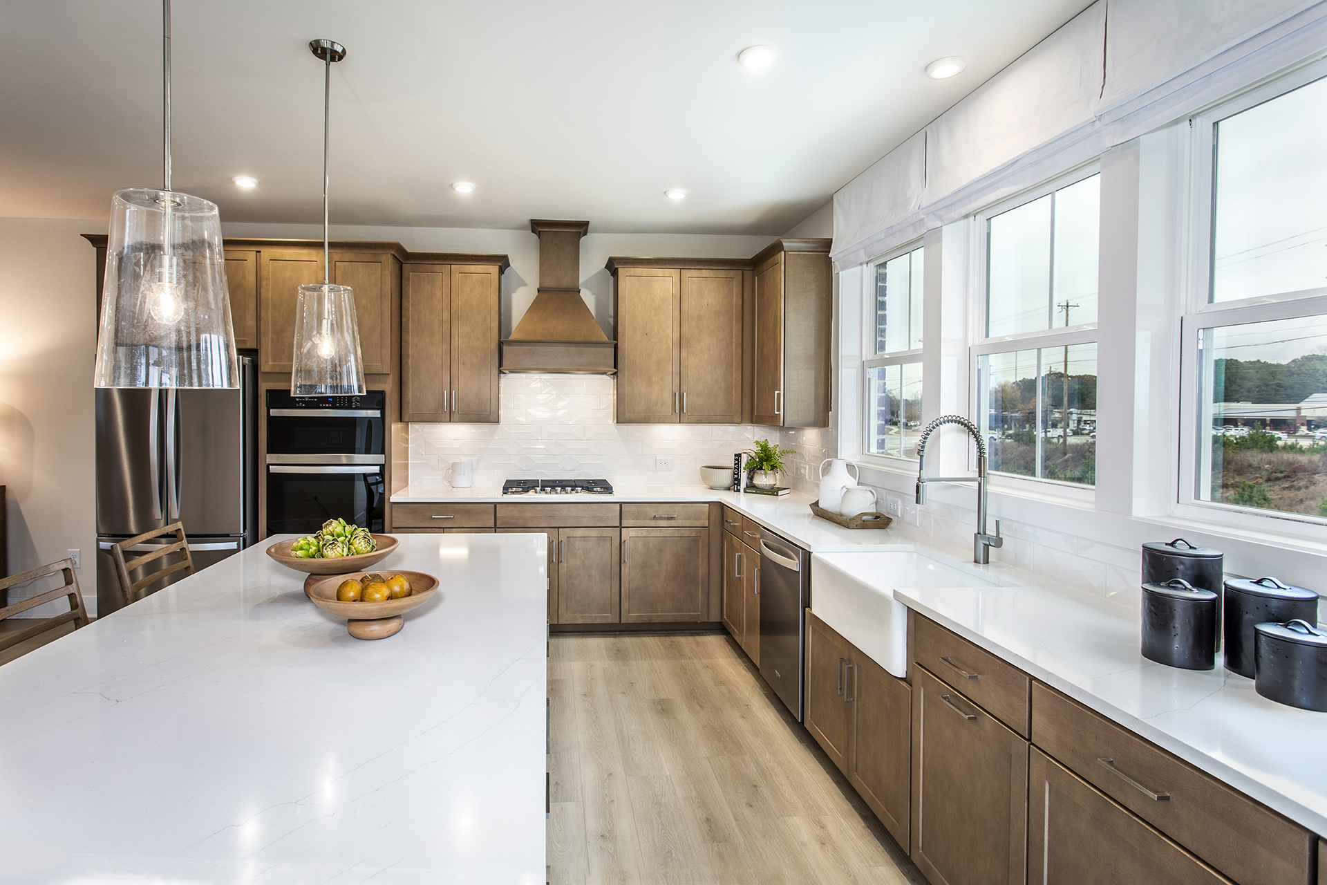 kitchen with wood-finish cabinets and white quartz counters