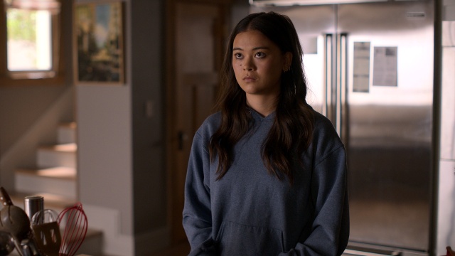 Lukita Maxwell as Alice Laird standing in the kitchen in Shrinking