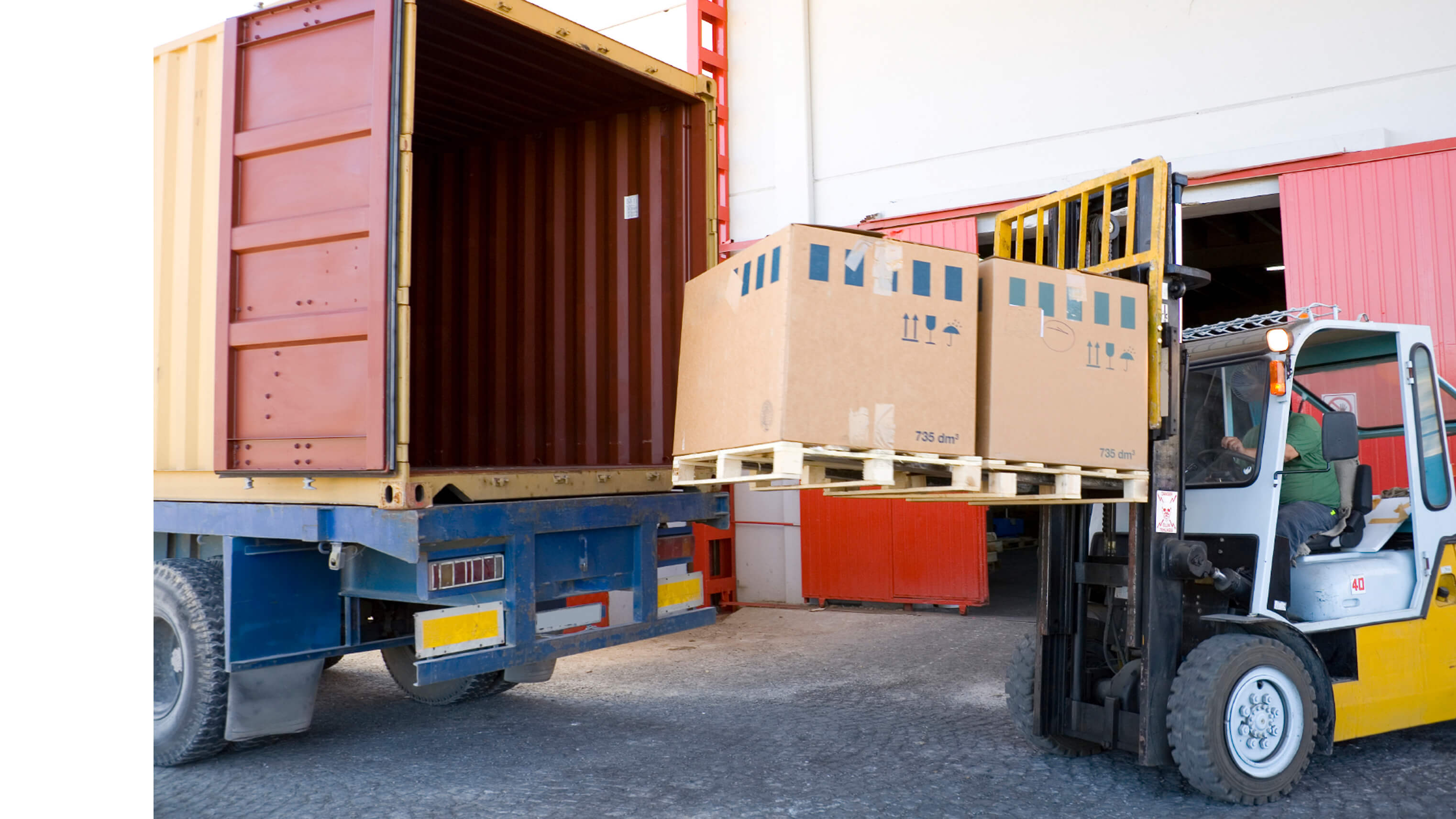 Image of a tow motor carrying boxes.
