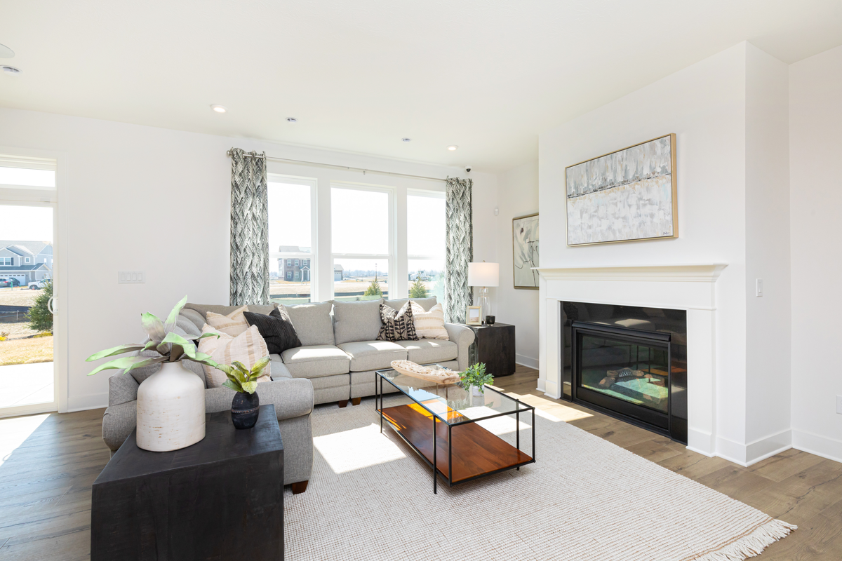 great room with fireplace and hardwood floors 