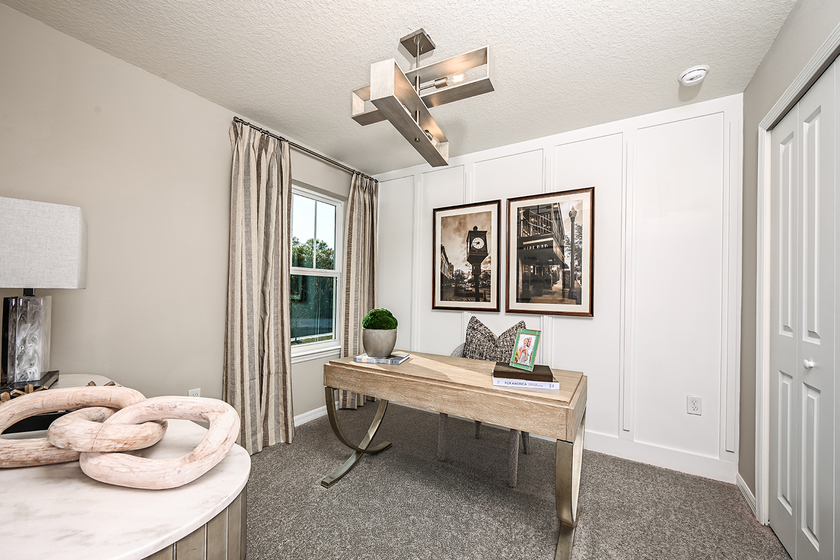 secondary bedroom with carpet, desk, and chair
