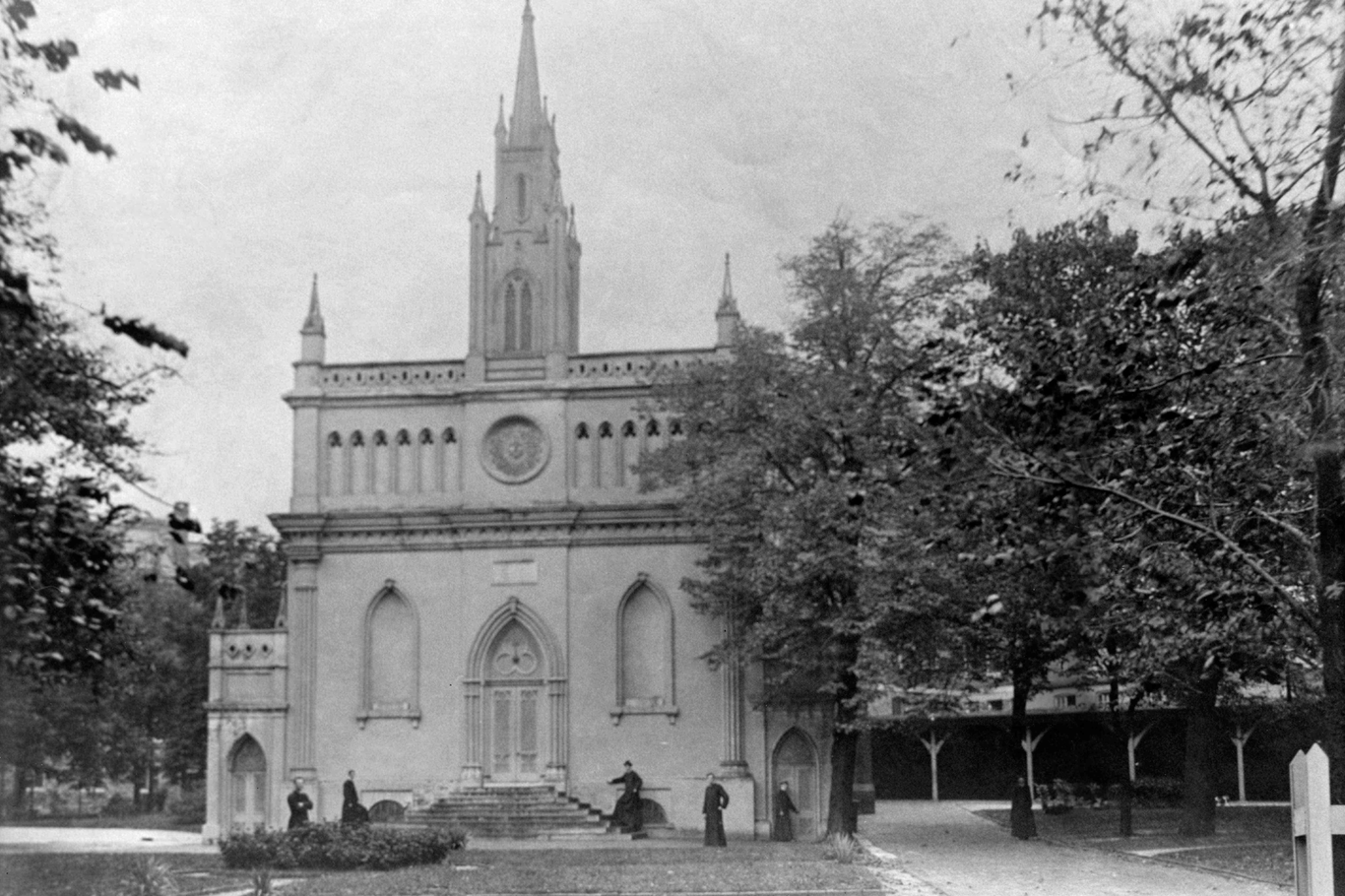 The chapel, once surmounted by a wooden steeple, is pictured circa 1890.