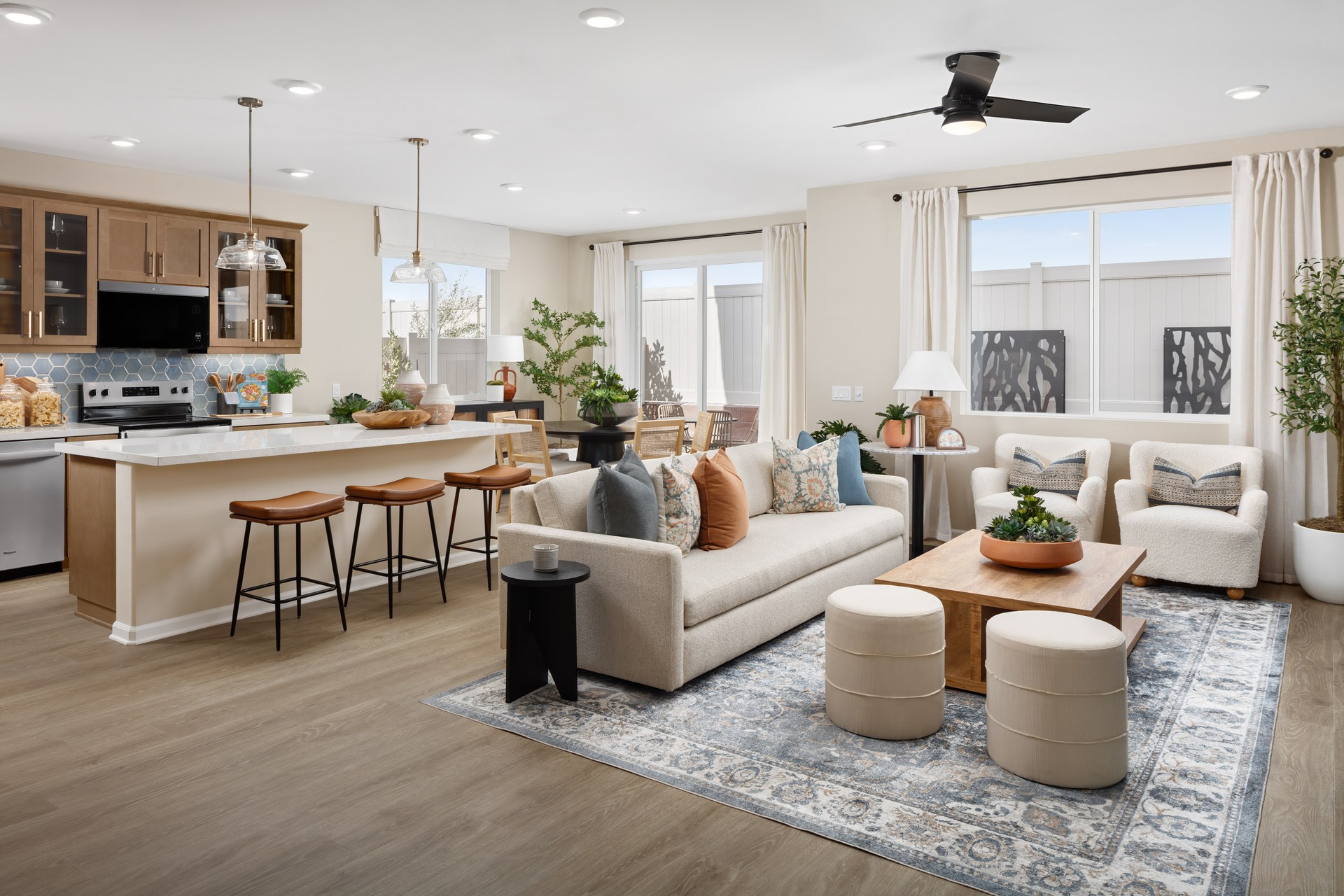 great room with neutral floors near kitchen