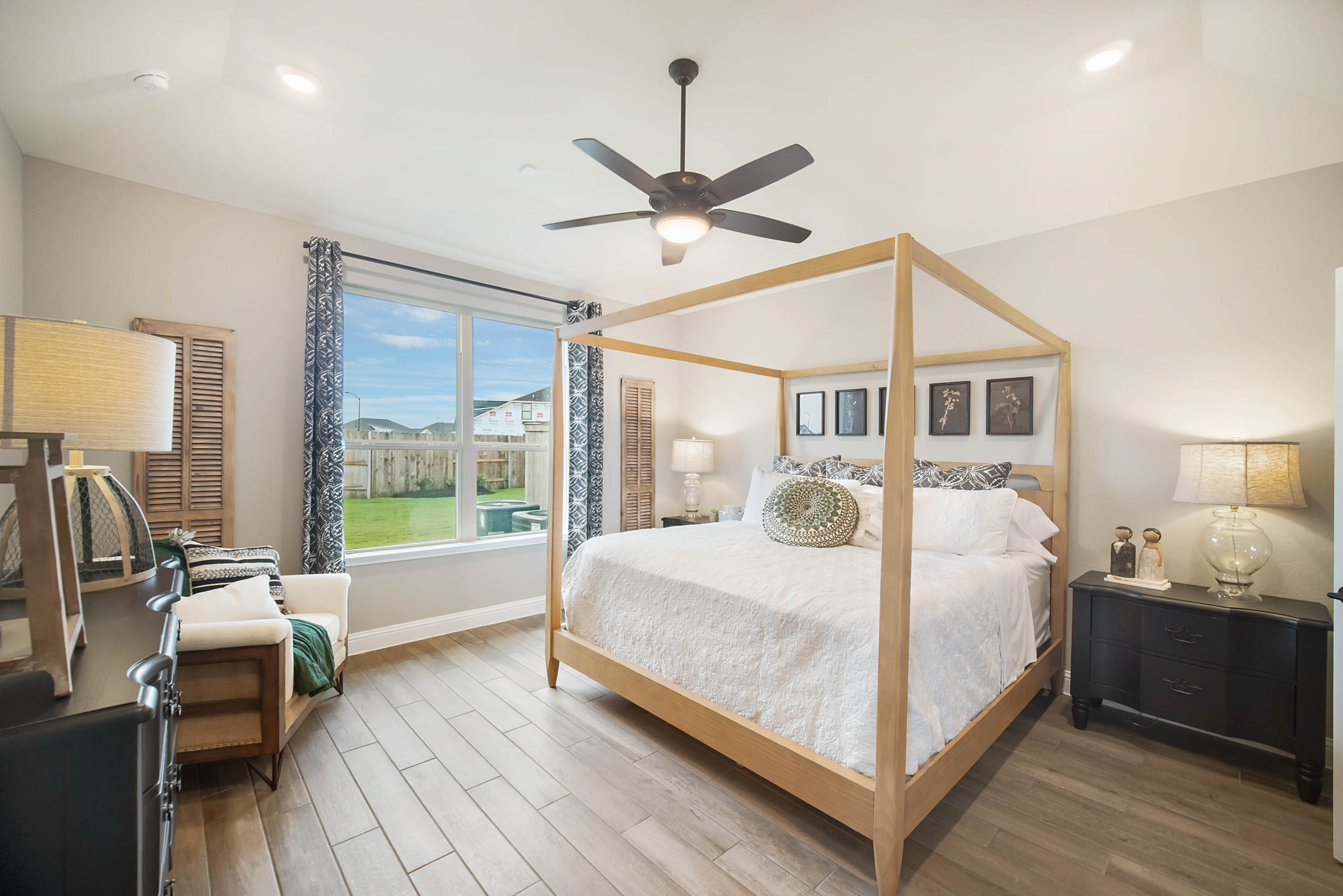 primary bedroom with carpet floors and ceiling fan