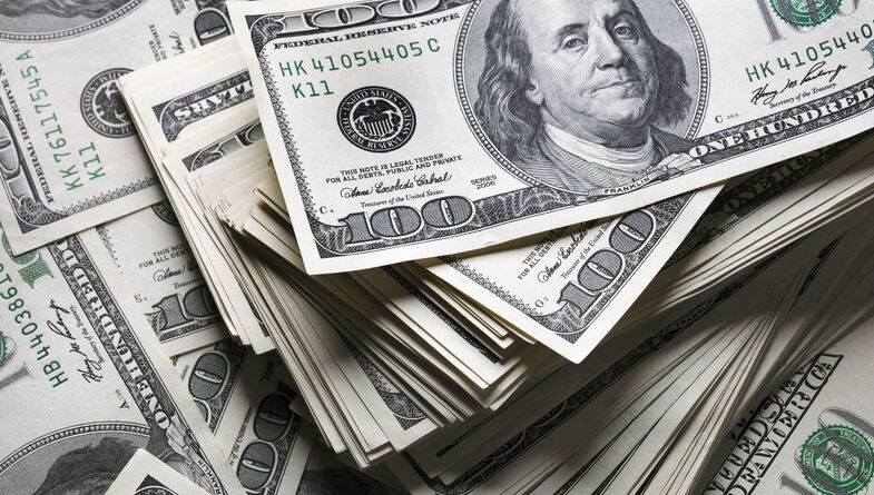 Up close view of stacks of hundred dollar bills