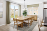 dining area with neutral floors and large windows