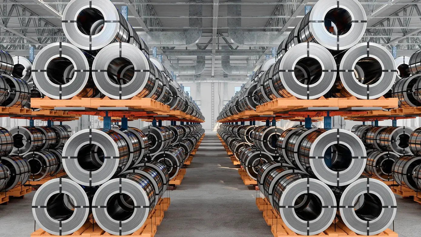 Multi-ERP-Environment-Benefits-Card-1470272541-1390x782.webp Image of round metal spools in a warehouse.