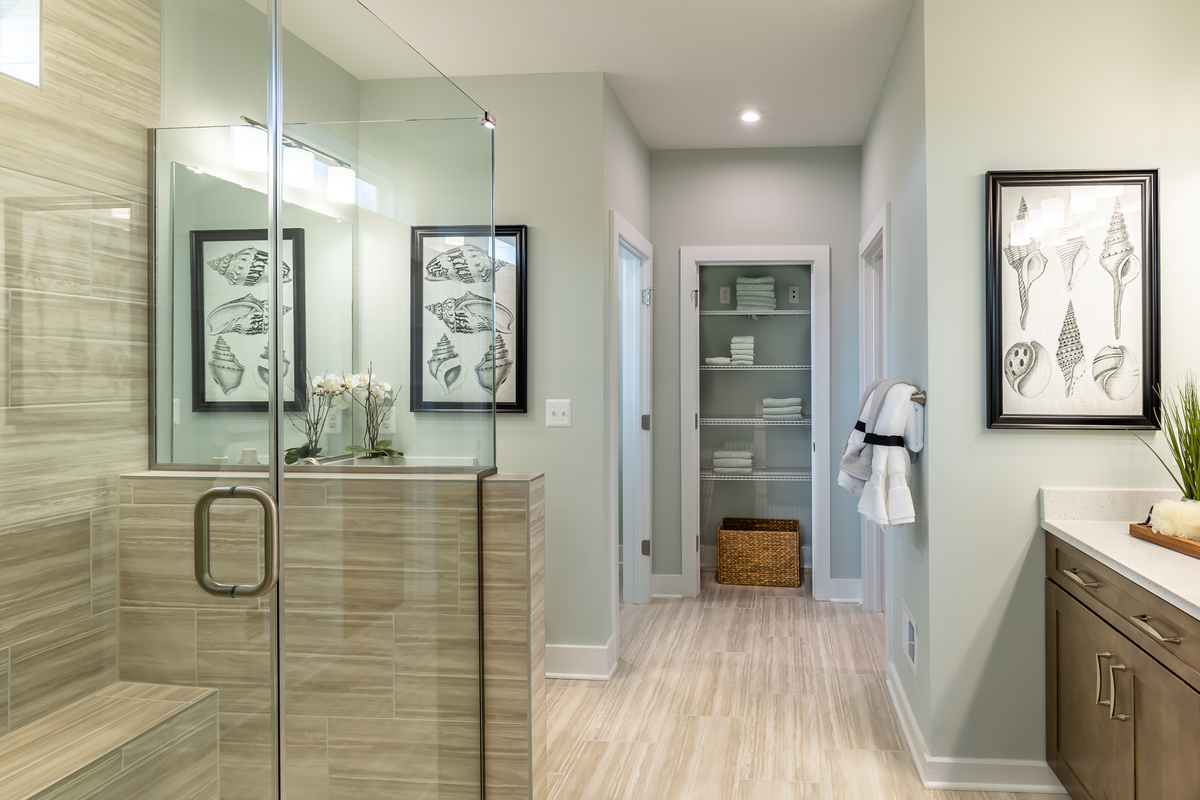 primary bath with a separate tub and shower