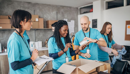 Volunteers collecting food items for a not-for-profit organization