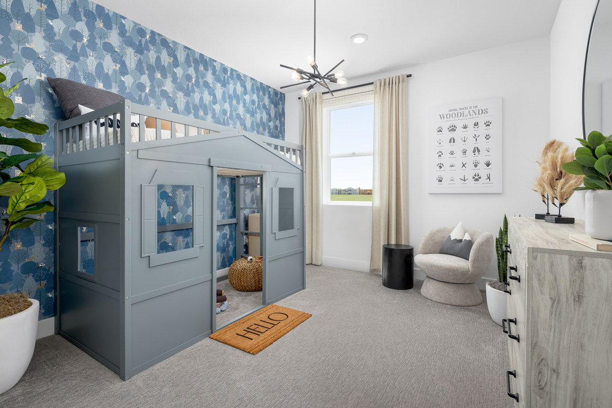 bedroom with blue playhouse loft bed & window