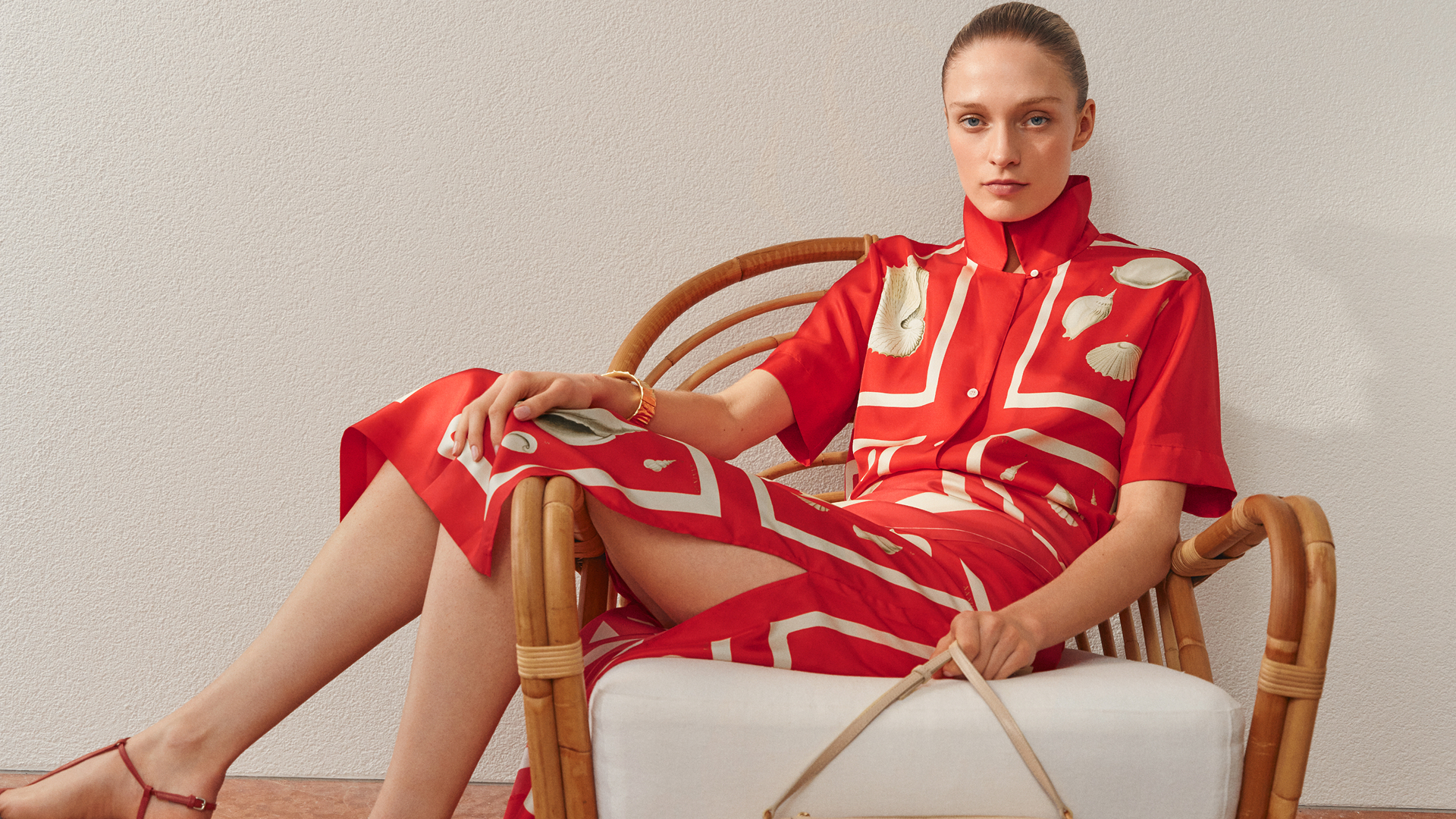 Woman wearing a red patterned Oroton dress