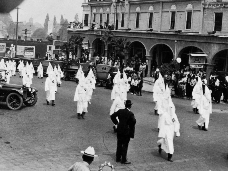Klan members march in Ashland, Ore., circa 1920