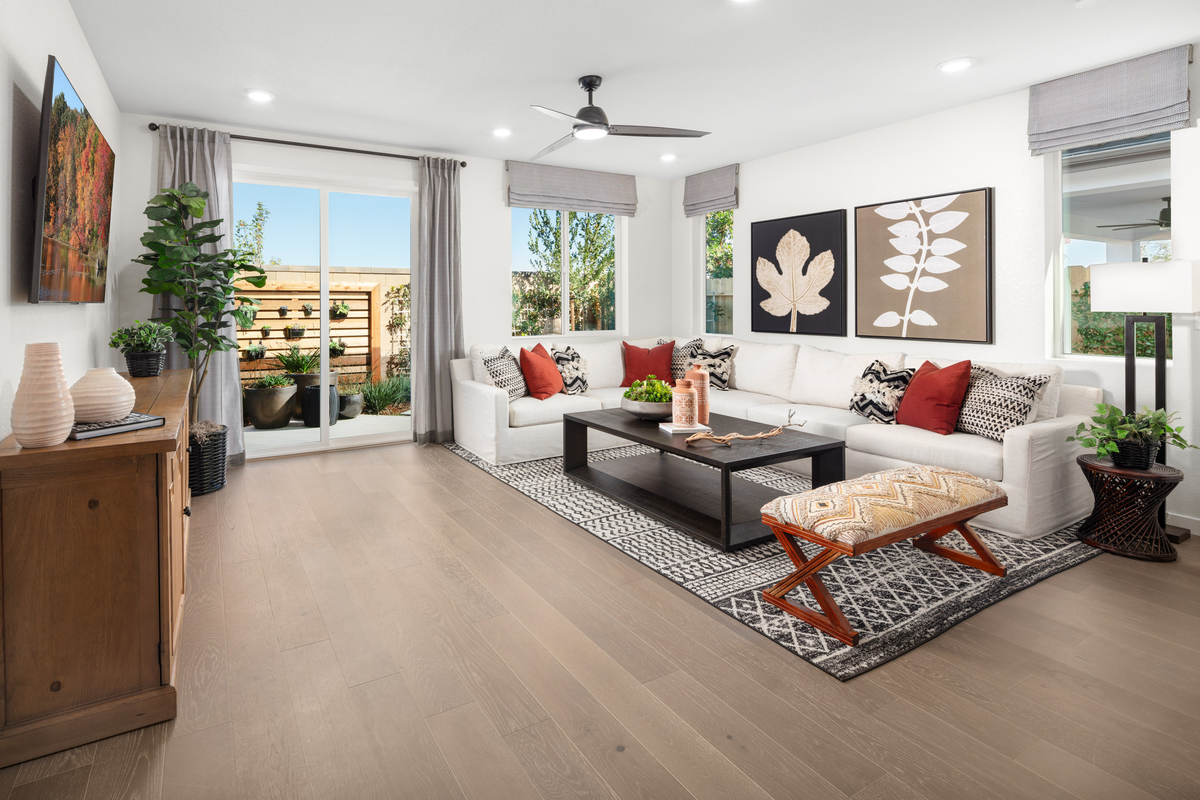 great room with tan tile floors and white sofa