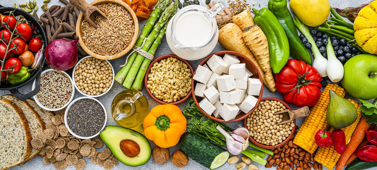 Overhead view of healthy organic fruits, vegetables and soy products.