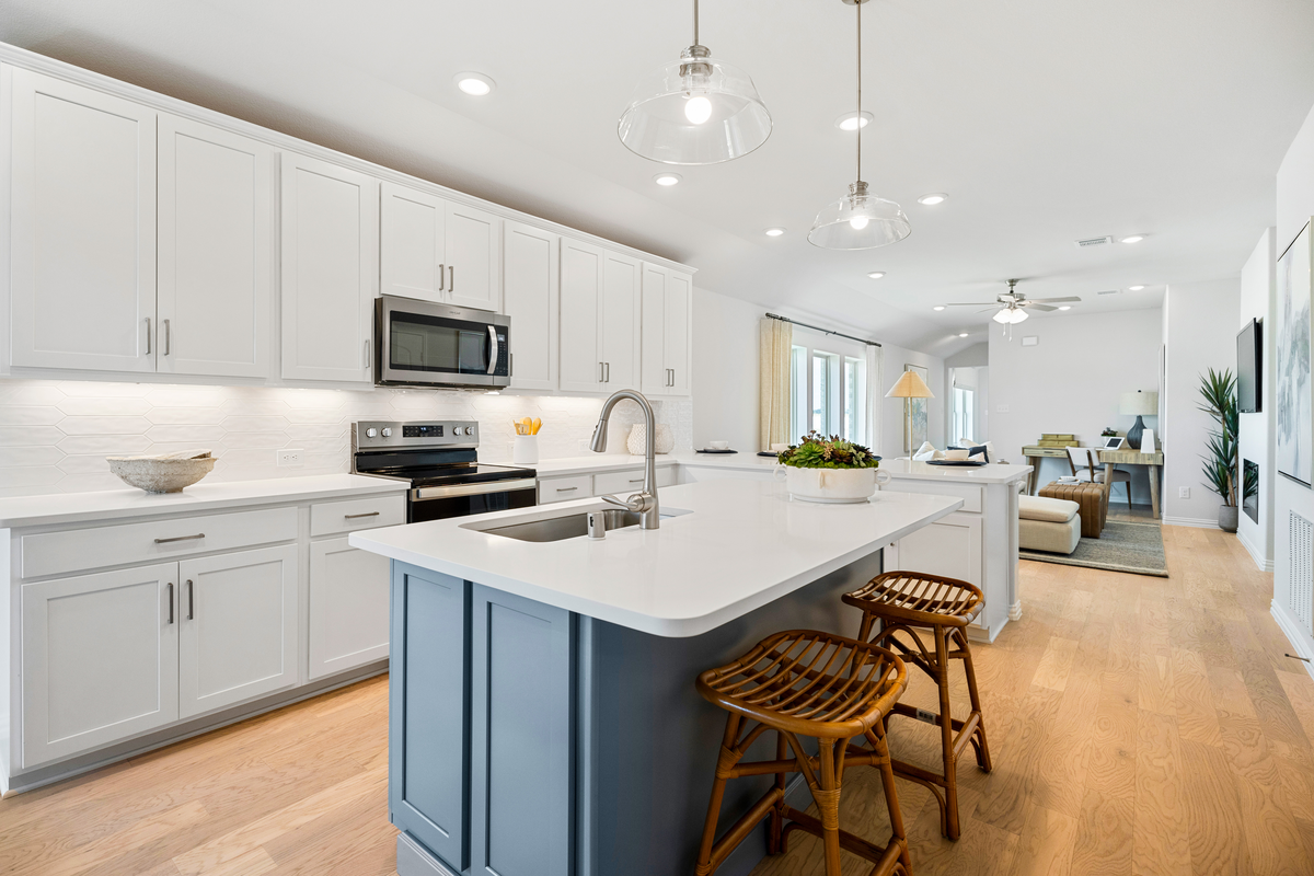 open kitchen with large island and wood floors