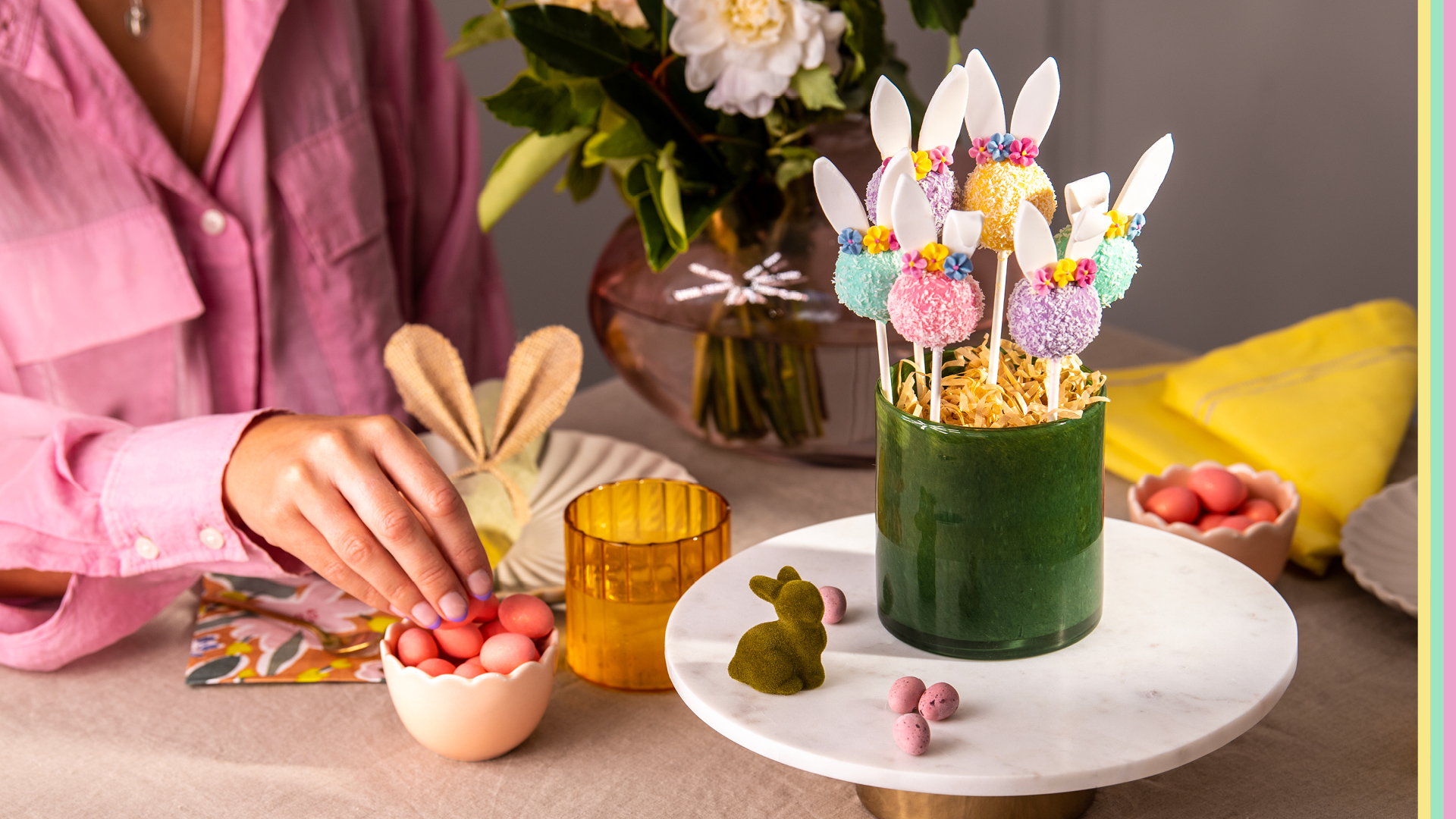 colourful easter cake pops with bunny ears, candied chocolate easter eggs