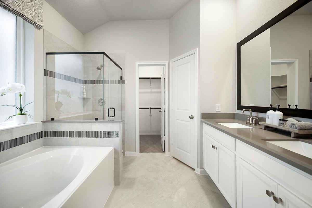 primary bathroom with bathtub and shower
