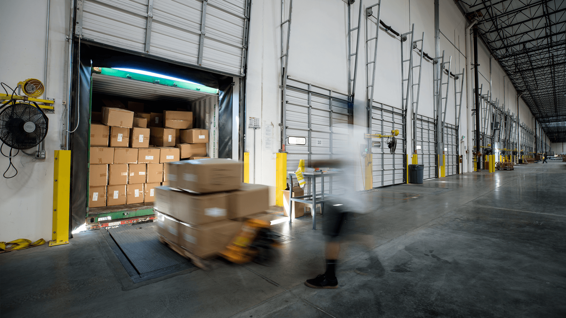 Real-time-Inventory-Promising-In Page-1.png Image of a boxes being loaded onto a truck.