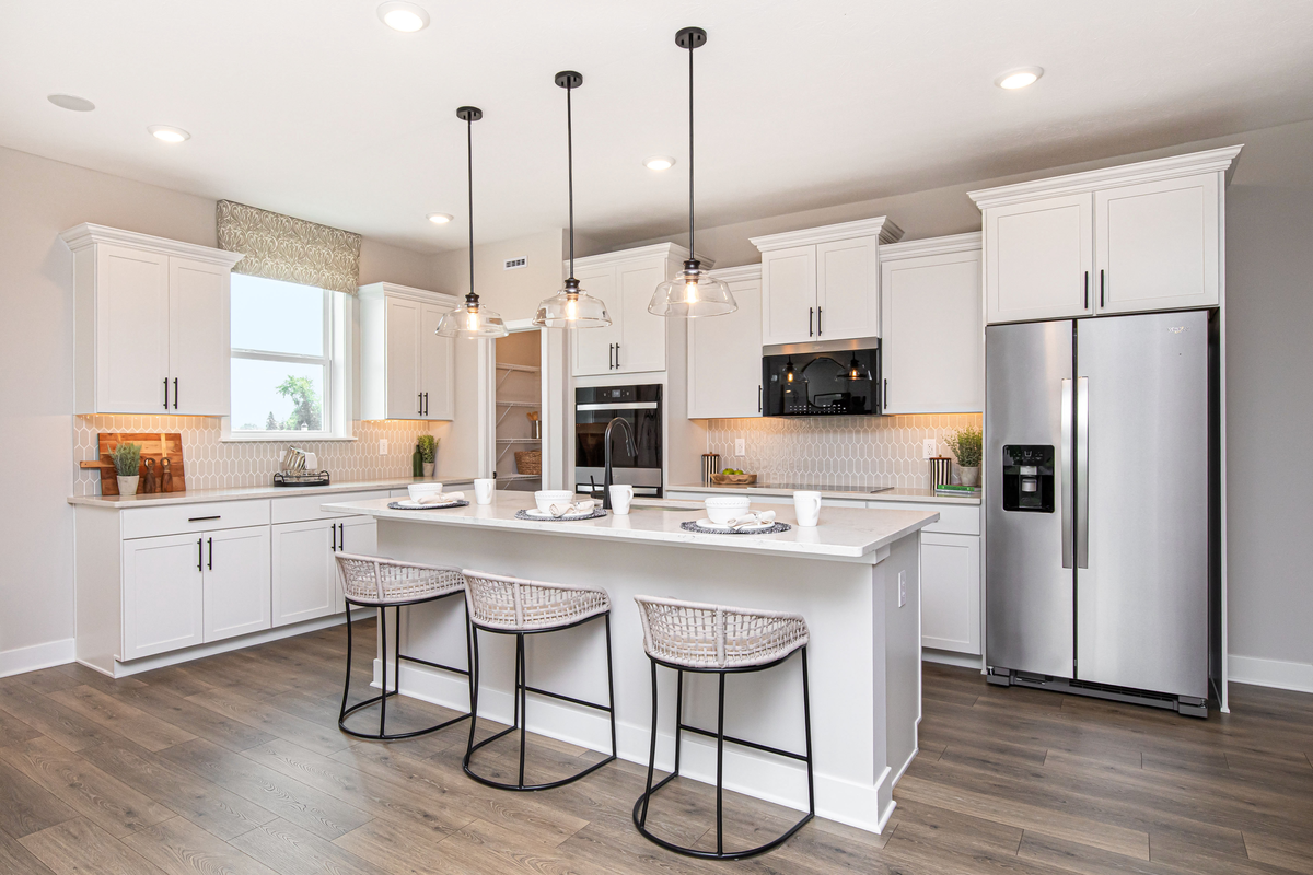 kitchen with white cabinets and large island