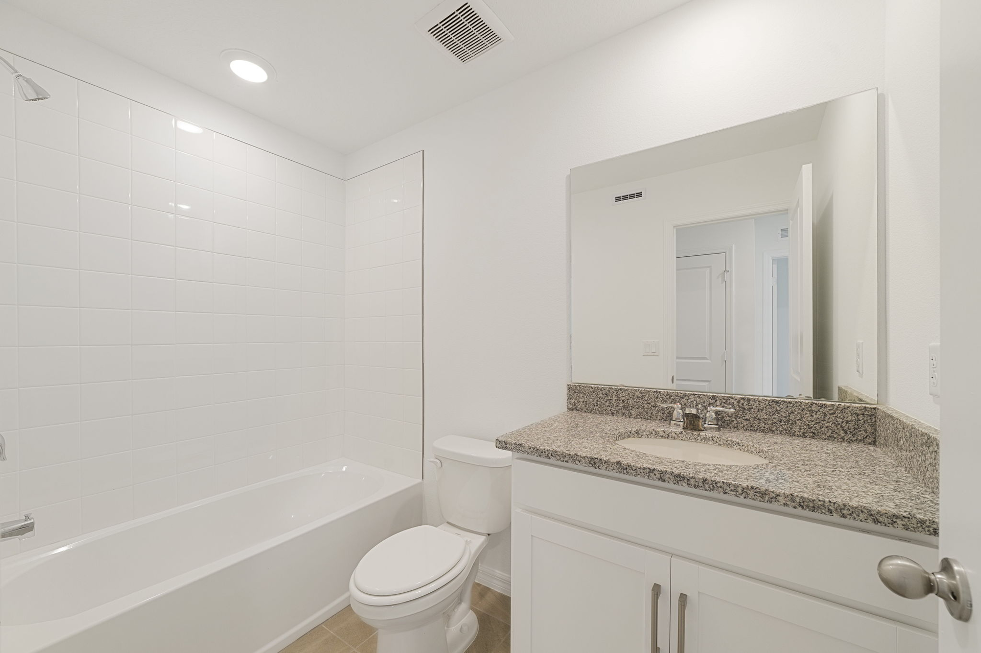 single sink vanity, water closet and tub